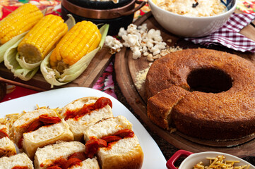 colorful table with lots of delicious food served in Brazilian June parties