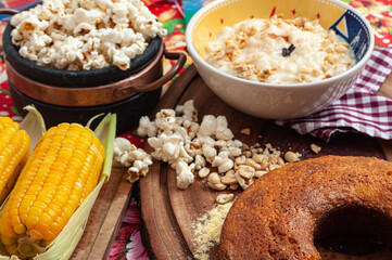 colorful table with lots of delicious food served in Brazilian June parties