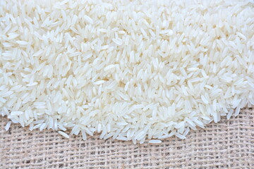 Basmati white rice solid texture. Top view close-up on raw rice grains.
