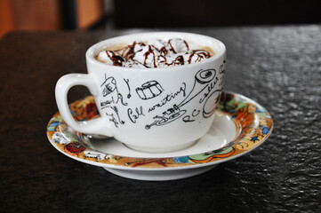 A cup of coffee latte serve with love and sugar