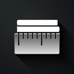 Silver Tape measure icon isolated on black background. Measuring tape. Long shadow style. Vector Illustration.