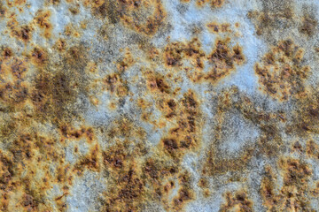Metal surface with old paint and strong corrosion. Dents, rust.