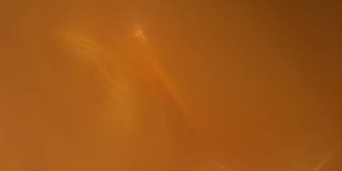 Abstract orange background with glowing flashes