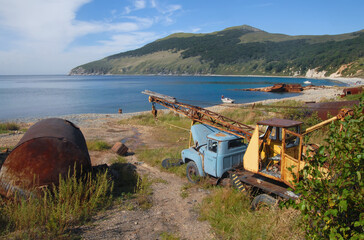 Old rusty soviet technic on the beach of Nayezdnik bay (Sea of Japan). Askold island, Primorsky...