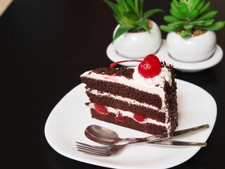 Chocolate velvet cake served with hot tea 