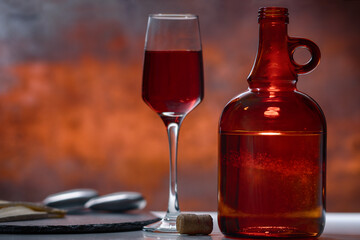 Elegant glass of red wine with carafe or decanter
