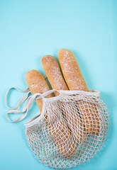 Fresh homemade wheat baguette in an eco bag