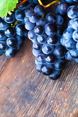 Grape on a wooden barrel. Macro image.