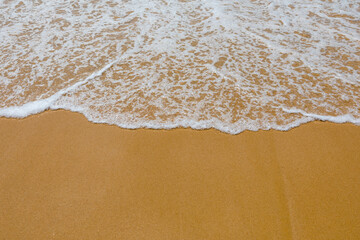 Soft wave of the sea on the sandy beach