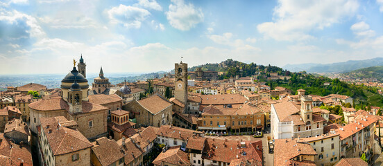 Fototapeta na wymiar Bergamo, Lombardy / Italy. April 24, 2015. Panoramic view of the historic center from the Gombito tower.