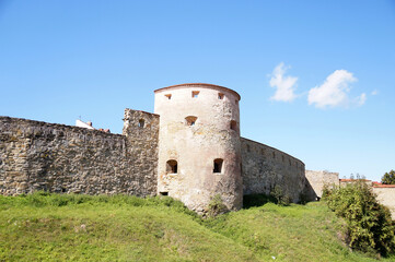 Fototapeta na wymiar Fortress wall and watchtower without a roof in the old town in Slovakia