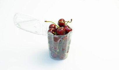 cherries in a  recycled plastic bowl