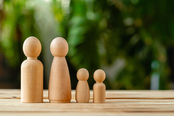 Wooden little figures of people. Family concept - Powered by Adobe