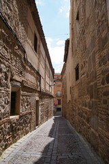 Toledo town street view with historical buildings in Spain.