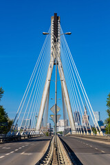 Panoramic view of Swietokrzyski Bridge - Most Swietokrzyski - with Vistula river with Srodmiescie city center of Warsaw, Poland in background