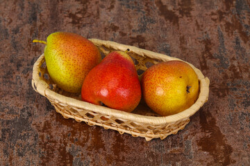 Pear heap in the wooden basket