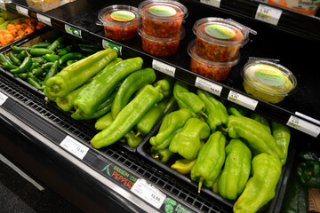 Green Peppers Inside of a Grocery Store