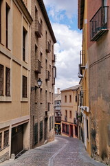 Fototapeta na wymiar Toledo town street view with historical buildings in Spain.
