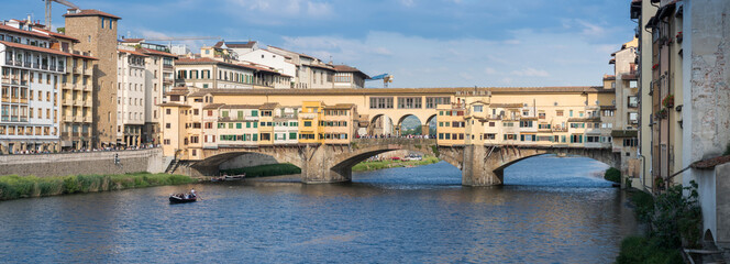 Panoramic view of the old bridge "Ponte Vecchio" and the Arno river in Florence, Italy