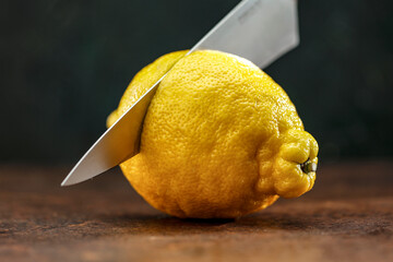 Lemons on a wooden table with space for fresh juice