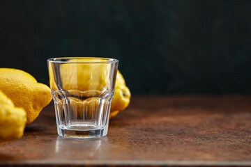 Lemons on a wooden table with space for fresh juice