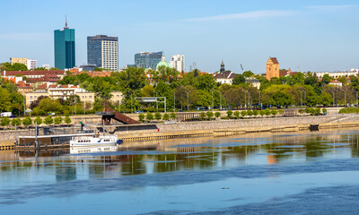 Panoramic view of Stare Miasto historic Old Town and  northern districts along Vistula river with Most Slasko-Dabrowski bridge in Warsaw, Poland