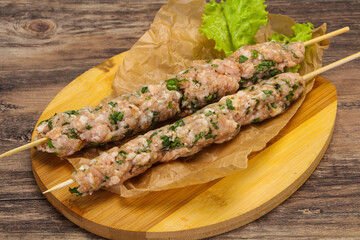 Raw minced pork skewer kebab for grill