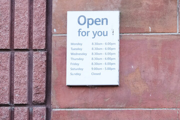 Business shop opening hours day and time sign
