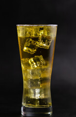 glass of beer with ice cube 
float