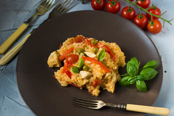 Rice and chicken breast cooked in tomato sauce.