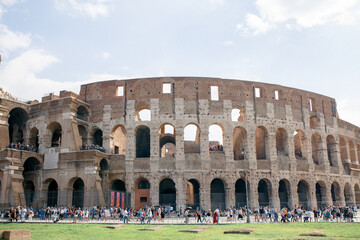 Naklejka premium view of the roman coliseum on a hot summer day in the tourist season