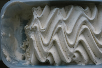 Closeup of tasty vanilla ice cream background. Close up wavy texture.