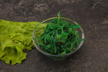 Green Chuka Seaweed Salad Isolated on White Background Top View. Wakame Sea Kelp Salat