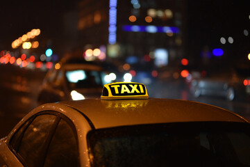 taxi sign on car in the night city