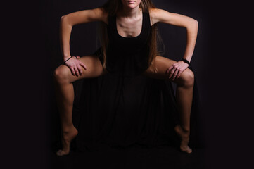 Young and beautiful girl dancer posing in studio.