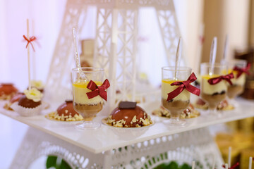 Delicious sweet buffet with cupcakes. Sweet holiday buffet in the Eiffel style