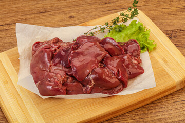 Raw chicken liver over board