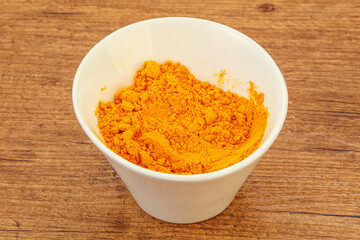 Tumeric powder in the bowl