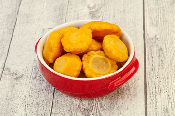 Marinated yellow patisson in the bowl