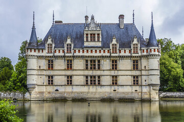 Fototapeta na wymiar Chateau of Azay-le-Rideau was built from 1515 to 1527 - one of earliest French Renaissance chateaux. Island in Indre River, its foundations rise straight out of water.