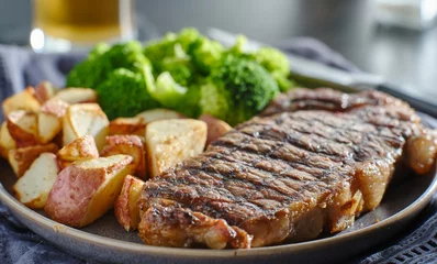 Fotobehang grilled new york steak with broccoli and roasted potatoes © Joshua Resnick