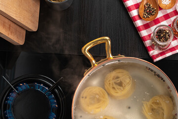 Cooking pasta at home in a pot close up