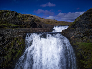 Haifoss waterfall in the highlands of Iceland, Aerial view. Dramatic landscape of Waterfall in Landmannalaugar canyon