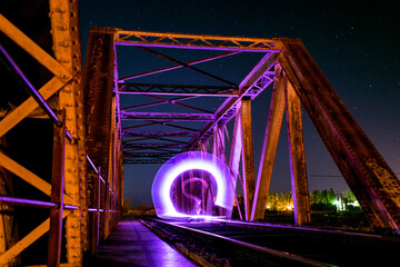 lightpainting on train bridge at night