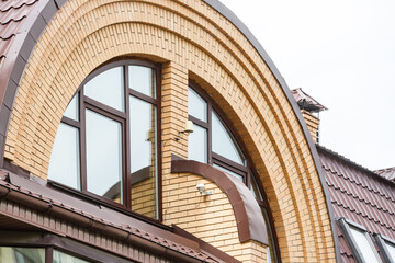 Classic garrets on a red tile roof.