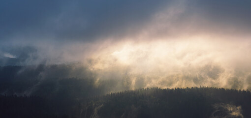 Panorama of morning fog landscape in the mountains of Saxon Switzerland, Germany  