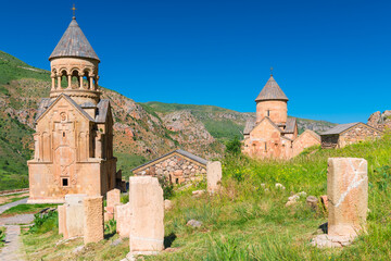 Fototapeta na wymiar Noravank Monastery surrounded by picturesque red mountains, a landmark of Armenia