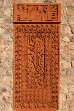 Traditional Armenian khachkar with a carved pattern on a stone close-up