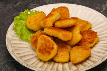 Fried chicken nuggets served salad leaves