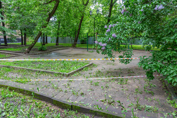 Red and white police line at the playground. The ban on visiting the territory